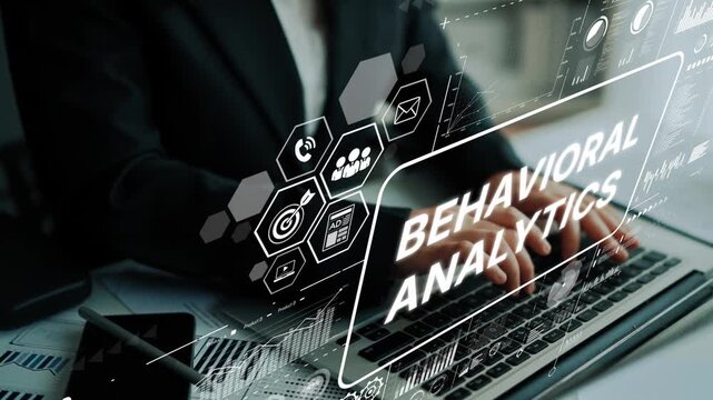 Business professional analyzing data using behavioral analytics on a laptop in a modern workspace, showcasing digital technology. Asymptotic smart data analytic.