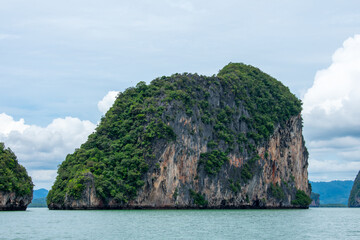 Naklejka premium Beautiful tropical landscape, Andaman sea and islands near Phuket in Thailand. James Bond or Khao Phing Kan Island and Boats on sea water