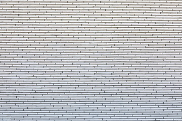 Gray brick wall with horizontal pattern and subtle texture. Construction material, architectural background, urban surface. Real photo