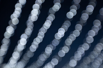 Light reflections create patterns on a surface during the evening in an indoor space