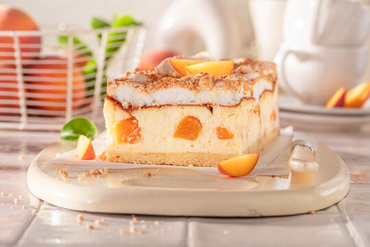 Tasty peach cheesecake made of fresh fruits and meringue.