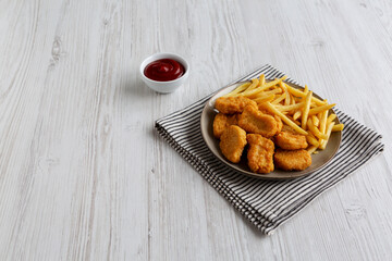 Chicken Nuggets served with French Fries and Ketchup