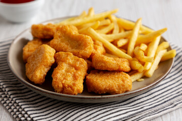 Chicken Nuggets served with French Fries and Ketchup