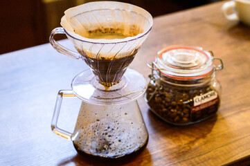 Brewing fresh pour over coffee using a glass dripper