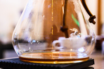 Chemex pour over coffee brewing in glass carafe