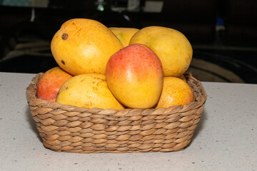 Basket full of Ripe Mangoes