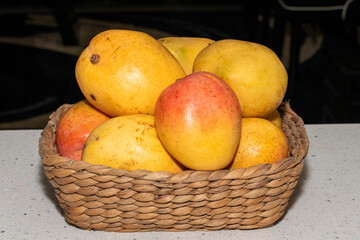 Basket full of Ripe Mangoes