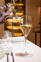 A sparkling wine glass takes center stage on a stylish table, exuding elegance and charm