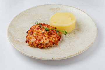 A cheesy baked creation paired with smooth potato puree delights the senses beautifully