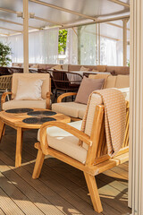 Relaxing outdoor space features inviting chairs and cozy cushions, perfect for leisurely afternoons
