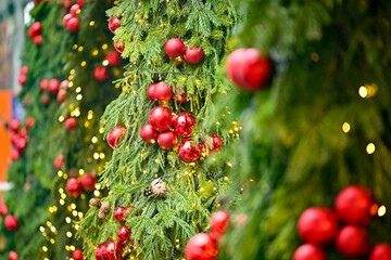 A tree covered in red and green Christmas decorations
