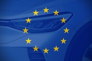 Close up car with the European flag as background.