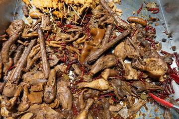 Assorted poultry parts at Chinese street food stall