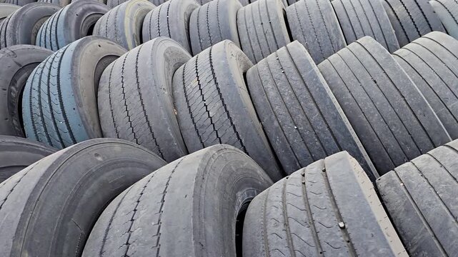 Used bus tires left on the ground.