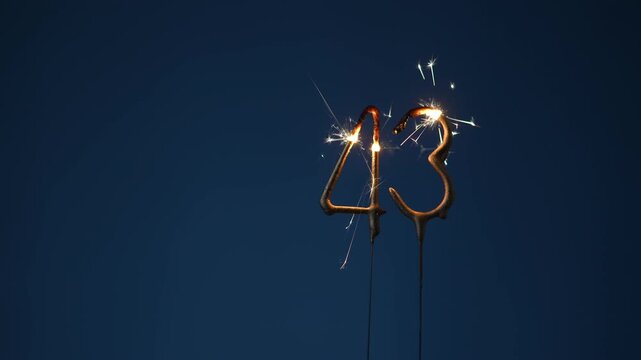 43 years celebration festive background made with Bengal fires in the form of number Forty three.