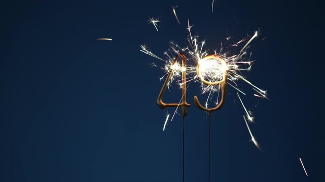 49 years celebration festive background made with Bengal fires in the form of number Forty nine.
