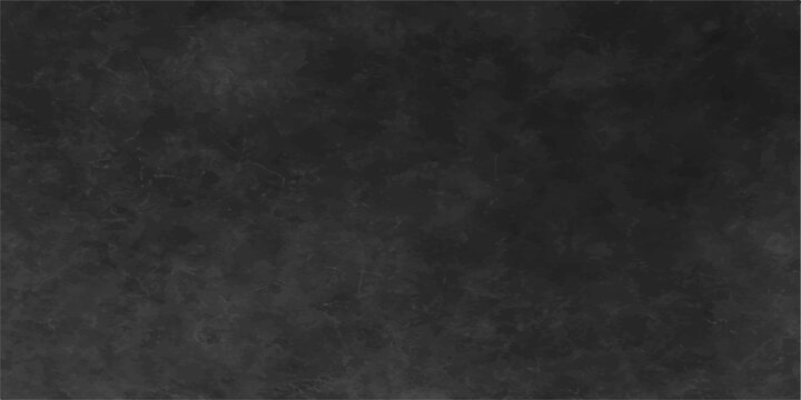 A dark grunge texture background of aged, rough black paper with a vintage blank wall pattern