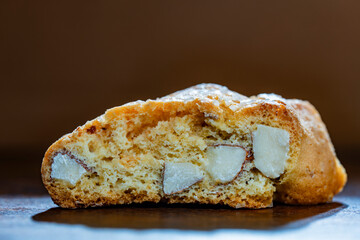 Traditional Italian almond biscuit, cantucci cookie on a wooden table, closeup