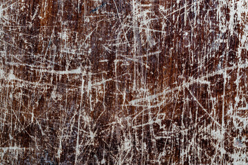 Background and texture of old scratched wood panel, closeup, top view. Wooden rough surface
