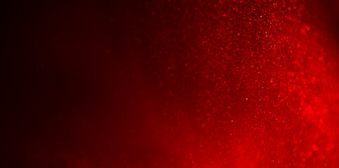 Christmas red background, Liquid red metallic dust floating,  abstract backdrop. Beautiful metallic dust texture, fractal, paint close-up. Art Wallpaper waves surface. Real photo 