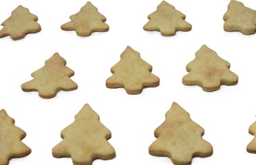 Close-up composition of Christmas tree cookies isolated on a white background. Warm festive baked treats arranged decoratively for holiday design, packaging, and creative seasonal visuals.