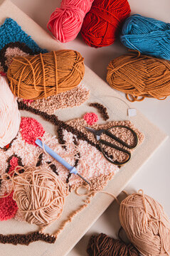 Punch needling kit, threads, canvas and needle for handmade crafts top and vertical view