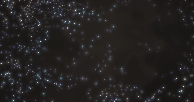 Against a dark background, an abstract picture of the turbulent motion of luminous particles unfolds, resembling a scattering of snow in space. The points of light move chaotically, creating a mesmeri