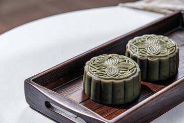 Traditional Chinese Mooncake.Mid-Autumn Festival Mooncake.Chinese Pastry Mooncake on Table.Chinese Festival Mooncake Food Photography.Classic Baked Mooncake Dessert.Assorted Traditional Mooncakes.