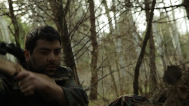 A focused sniper in camouflage uniform lies prone in a dense forest, aiming his rifle with precision while looking through the scope, ready for a crucial mission.