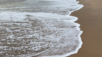 sandy beach shoreline calm ocean waves natural background, summer concept background
