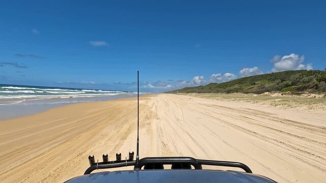 Point of view of a car driving at the beach of K&acute;Gari, Australia