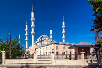 Central Mosque of Imam Sarakhsi on Zhibek Zholu Avenue in the capital city Bishkek, Kyrgyzstan. Summer sunny day