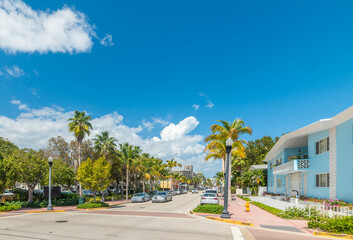 Miami Beach street under a blue sky with white clouds