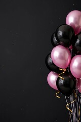 Balloons in shades of pink  black on a dark background with gold ribbons