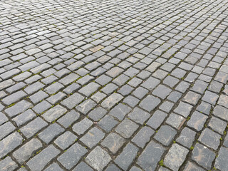 Abstract background. Old cobblestone pavement closeup