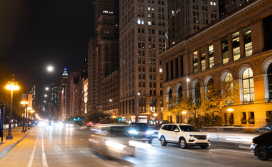 Naklejka premium City night illuminated building. Skyscraper cityscape. Night city of Chicago. Business city. Night cityscape of Chicago skyscraper building. Chicago architecture of skyscraper. Midnight downtown