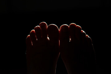 Two Feet Together in Backlight