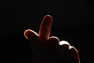 Index Finger Pointing Upwards in Backlight