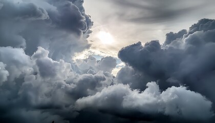 Overcast Sky Background Filled With Dense Gray Clouds With A Faint Bright Spot In The Center Hinting At Diffused Sunlight