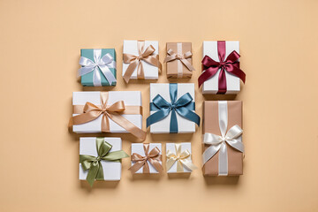 Various gift boxes wrapped with ribbons on a light background, offering feelings of surprise, giving, and holidays