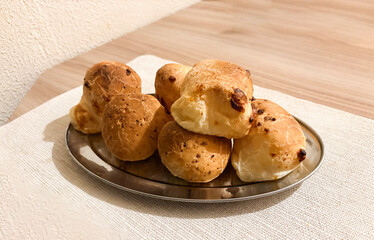 Golden Cheese Bites: A tantalizing arrangement of freshly baked, golden-brown cheese bites on a sleek plate, promising a burst of flavor and a moment of culinary delight.