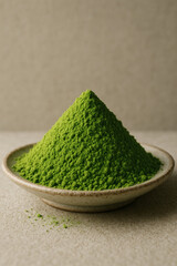 Pile of vibrant green matcha powder, a culinary delight, presented on a ceramic plate, ready to infuse a touch of Japanese tradition.