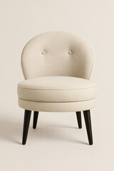 Elegant ivory chair with a rounded back and black legs, perfect for adding a touch of class to any living space or boudoir. A timeless piece.