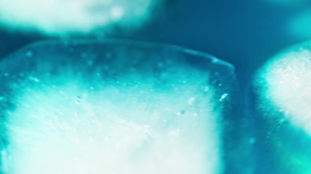 Macro shot of ice cubes inside a blue cocktail