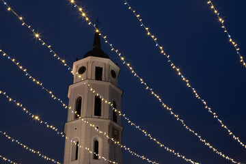 Vilnius Cathedral Bell Tower Framed by Sparkling Christmas Lights at Night