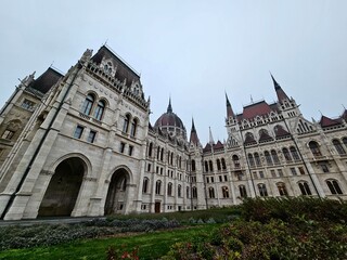 Fototapeta premium The Hungarian Parliament building in Budapest during the day in cloudy weather.