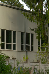 Peaceful exterior view of nature, Tranquil outdoor panorama with fencing and plants, Quiet outdoor setting highlighting fencing perimeter surrounded by green shrubs and expansive scenery