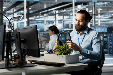 Server farm IT expert quitting job, preparing belongings for departure. Data center programmer...
