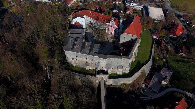 Aerial view of Tittmoning Castle, historic medieval fortress located in Traunstein district of Bavaria, Germany. Scenic landscapes, stone walls, cultural heritage site. Luftaufnahme Burg Tittmoning. 