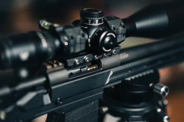 A sniper rifle scope with a round in the chamber.